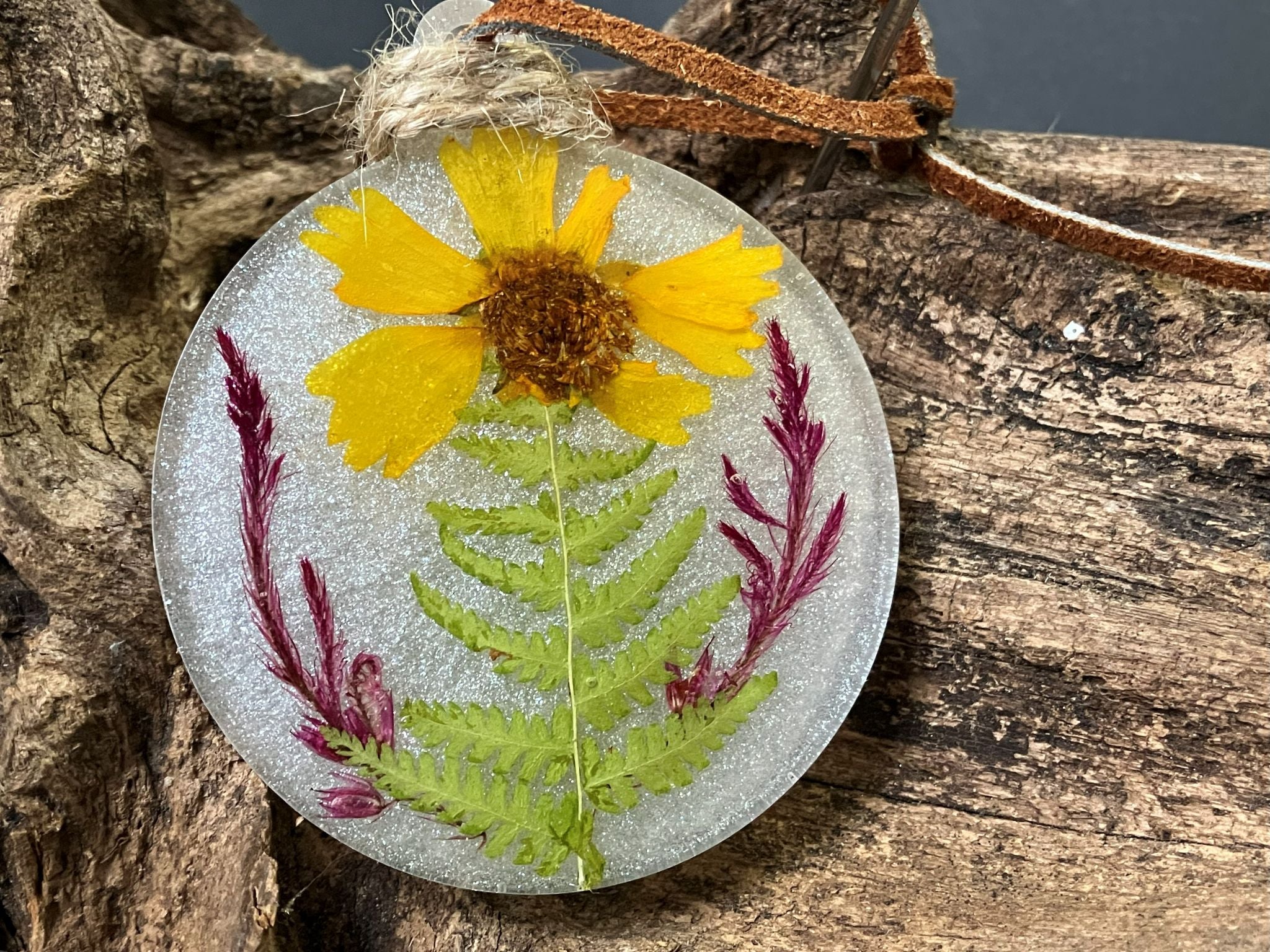 White shimmer resin ornament shaped like a Christmas tree with real coreopsis flowers, handcrafted by R & D Floral.